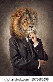 Lion In A Suit. Man With A Head Of An Lion. Concept Graphic In Vintage Style With Soft Oil Painting Style. 