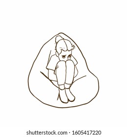 
Little Scared Girl Sitting On A Bean Bag Chair