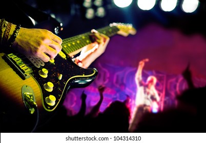 live music background,Guitar player and public - Powered by Shutterstock