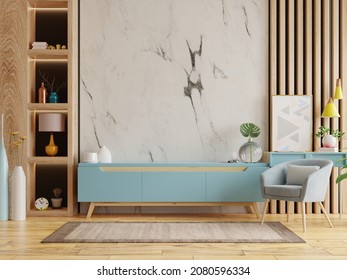 Living room interior with armchair and cabinet for tv on empty marble wall background.3D rendering