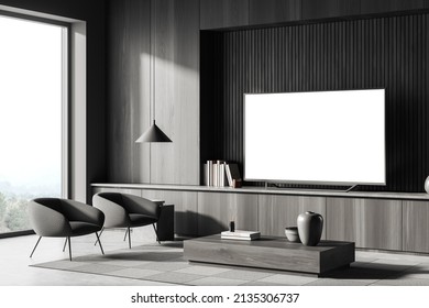 Living Room Interior With Armchairs And Coffee Table, Side View, Cabinet With Tv Set, Carpet On Grey Concrete Floor, Panoramic Window On Countryside. Mock Up Blank Tv Display. 3D Rendering