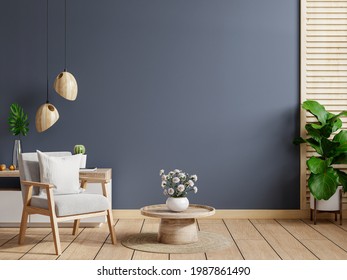 Living room interior room wall mockup in dark tones,gray armchair with wood cabinet.3d rendering