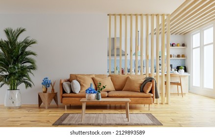 Living Room Interior Wall Mockup In Warm Tones With Leather Sofa Which Is Behind The Kitchen.3d Rendering