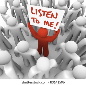 A Lone Person Seeks To Inform The Crowd Of People Around Him Of Some Important Information, Raising A Sign Or Placard That Reads Listen To Me In Hope Of Grabbing Attention And Getting An Audience