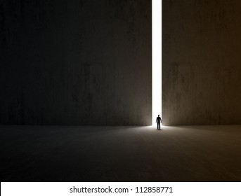 A Lonely Person Walking Through A Narrow Passage