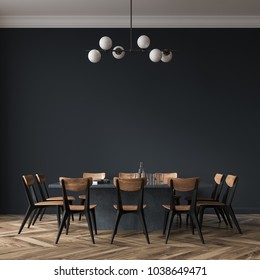 Long black dining room table with black and wooden chairs standing in a black room. 3d rendering mock up
