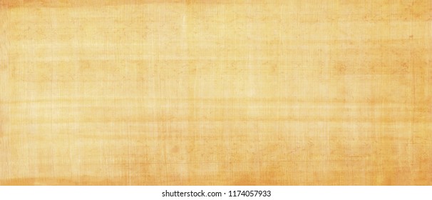 Long and wide background in horizontal position.Egyptian paper,papyrus old texture. Smooth yellow surface.Mediterranean region.