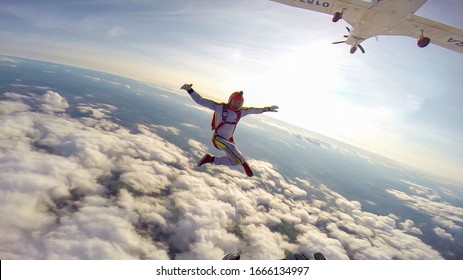 Looking Freedom Sky. Extreme Man Athletes Conquer The Sky. Height For Skydiving Freedom. A Sense Of Weightlessness And Freedom.