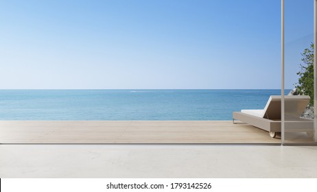 Lounge Chair On Terrace Near Living Room In Modern Beach House Or Luxury Villa. Cozy Home Interior 3d Rendering With Sea View.