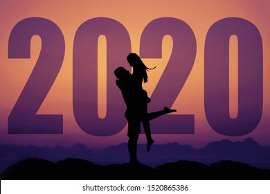 Love Couple Silhouette With Big New Year 2020 And Sunset As Symbol For Wedding And Marriage