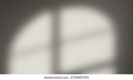 A low-resolution grayscale image featuring a blurry white shape against a dark background with noticeable pixelation and unclear details giving an abstract appearance