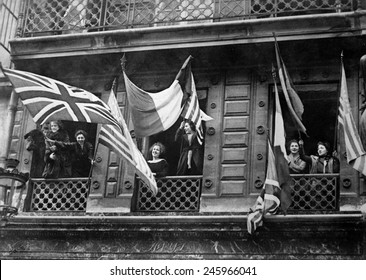 Luxemburg Women Wave Allied Flags From Their Windows To Greet The American Army Of Occupation At The End Of WWI. Nov.-Dec. 1918.