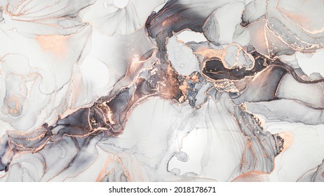Luxury abstract fluid art painting in alcohol ink technique, mixture of black, gray and gold paints. Imitation of marble stone cut, glowing golden veins. Tender and dreamy design.