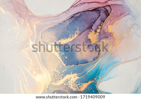 Luxury abstract fluid art painting in alcohol ink technique, mixture of blue and purple paints.  Imitation of marble stone cut, glowing golden veins. Tender and dreamy design. 