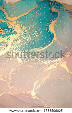 Luxury abstract fluid art painting in alcohol ink technique, mixture of blue and pink paints.  Imitation of marble stone cut, glowing golden veins. Tender and dreamy design. 