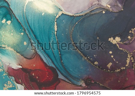 Luxury abstract fluid art painting in alcohol ink technique, mixture of dark blue and purple paints.  Imitation of marble stone cut, glowing golden veins. Tender and dreamy design. 