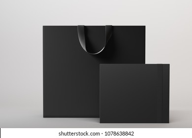 Luxury Black Shopping Bag And Box In White Studio. Front View. 3d Rendering Mock Up