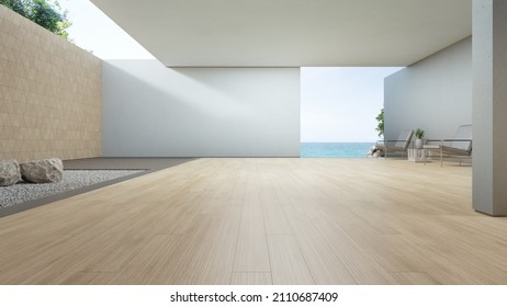 luxury interior design 3D rendering of modern sea view showroom or beach house. Empty wooden floor living room and white gravel zen garden with concrete wall background.