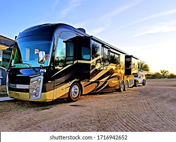 Luxury Motorhome Recreational Vehicle RV Parked On Dirt Lot At Sunset With Reflections Of Trees