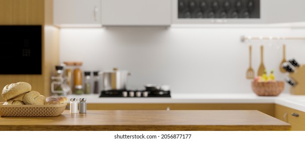 Luxury wooden kitchen tabletop with bread basket, salt and pepper bottles, empty space for montage display on blurred modern kitchen room background. 3d rendering, 3d illustration