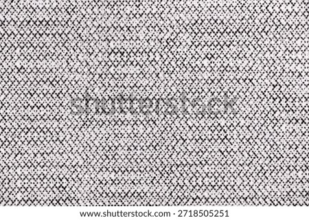 Macro image of a halftone dot pattern forming a dense, crisscrossing grid on white paper, printed in black ink with high detail.
