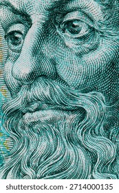 Macro view of an engraved face with beard on foreign currency, symbolizing finance