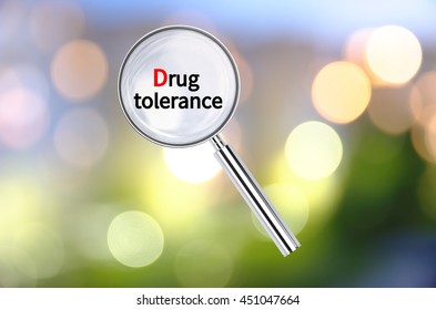 Magnifying Lens Over Background With Text Drug Tolerance, With The Blurred Lights Visible In The Background. 3D Rendering.