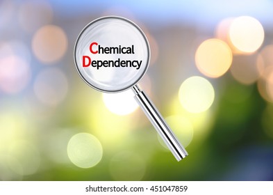 Magnifying lens over background with text Chemical dependency, with the blurred lights visible in the background. 3D rendering.