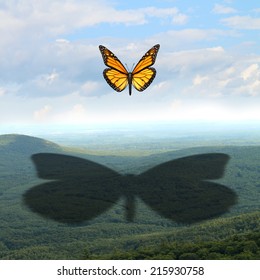 Make Your Mark And Leave A Big Impression Concept As A Small Butterfly In The Sky Casting A Giant Shadow On A Vast Landscape As A Communication And Marketing Symbol For Success In Business And Life.