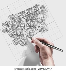 male hand with pen. engineer working on cad concept V8 Car engine