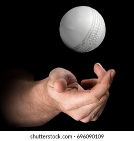 A Male Hand Tossing A Cricket Ball Up In The Air On An Isolated Dark Background - 3D Render