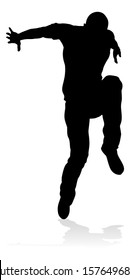 A Male Street Dance Hip Hop Dancer In Silhouette