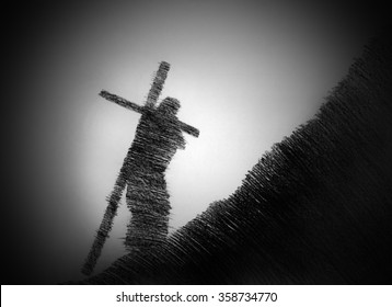 man carrying the cross up the hill
