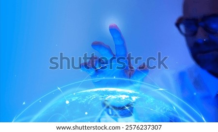 Man interacts with digital globe, blue light, futuristic technology. Digital globe, blue light, tech innovation. Futuristic tech, digital globe, blue glow. Virtual reality and futuristic technology.