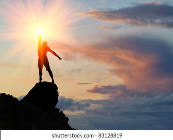 Man On Top Of The Mountain Reaches For The Sun