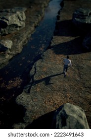 Man Runs Along A Rocky River. High Angle View. 3D Render.