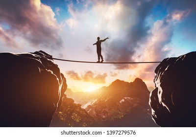 Man Walking On Rope Between Two High Mountains At Sunset. Concept Of Taking A Risk, Adventure, Motivation. 3d Illustration