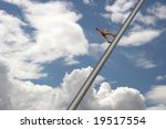 Man walking to the sky in front of clouds