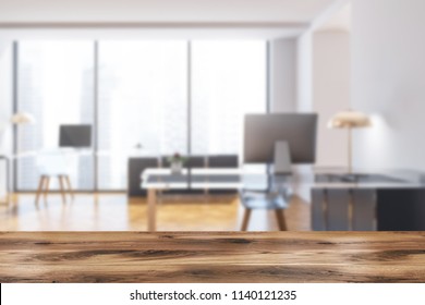 Manager Office Interior With Dark Gray Walls, Panoramic Windows, A Wooden Floor And A Stylish Computer Table. Front View 3d Rendering Mock Up Blurred