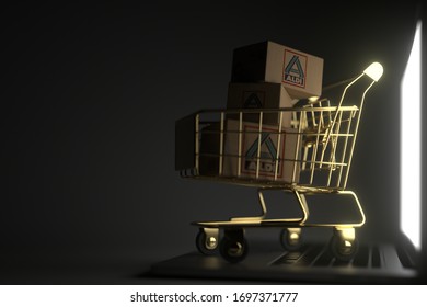 Many Cartons With ALDI Logo In Golden Shopping Trolley On The Laptop. Editorial Premium Service Related 3D Rendering