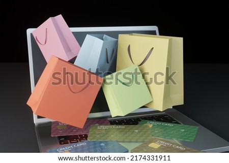 Many credits and a lot of shopping bags coming out of a computer screen. Illustration of the concept of credit card overspending and the social problems of prepayment. 3D rendering Foto d'archivio © 