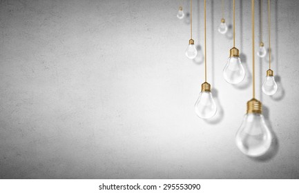 Many Glass Light Bulbs Hanging From Above