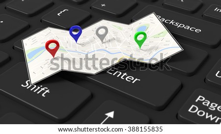 Map with colorful pointers set on black keyboard