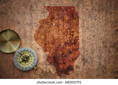 Map Of Illinois State On A Old Vintage Crack Paper Background With Compass