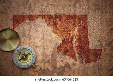 Map Of Maryland State On A Old Vintage Crack Paper Background With Compass