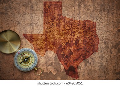 Map Of Texas State On A Old Vintage Crack Paper Background With Compass