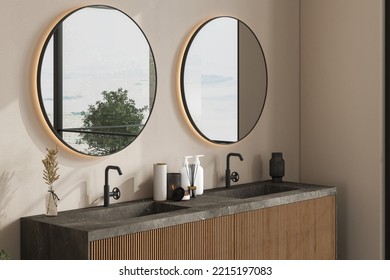 Marble Basin Standing On A Wooden Bathroom Furniture. Double Oval Mirrors Are Hanging On A Beige Wall. A Close Up. Front View. 3d Rendering