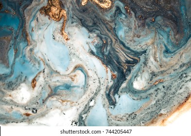 Marble texture. Eastern technique ebru. Contemporary art. Golden and turquoise mixed acrylic paints. Can be used as a trendy background for wallpapers, posters, cards, invitations, websites. 