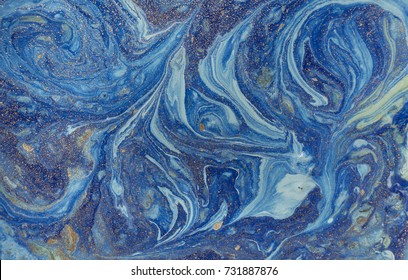 Marbled blue abstract background with golden sequins. Liquid marble ink pattern. - Shutterstock ID 731887876