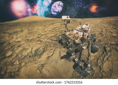 Mars Science Laboratory , Mars Exploration Rover . Mars Rover On Mars And In The Background The Earth . Elements Of This Image Furnished By NASA